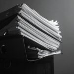 stack of papers in folders