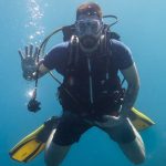 University of Rhode Island Professor and Fulbright recipient Christopher Lane underwater in scuba gear