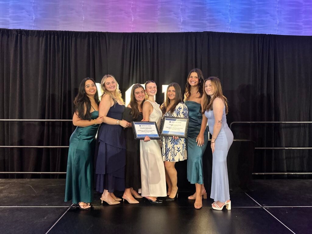 panhellenic officers accepting an award