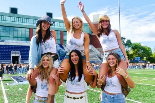 sorority sisters on the football field