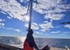 URI Ph.D. student Emmanuel Oyewole conducting field work on the deck of a vessel at the South Fork Wind farm turbines.