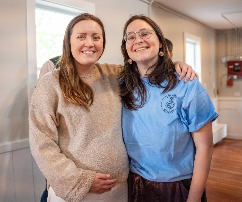 Two students, and friends, smile in Mosby.