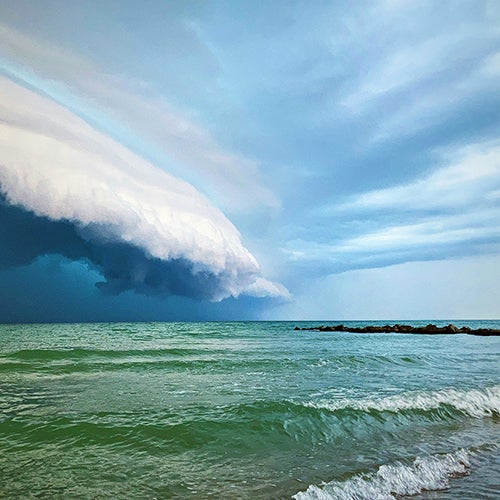 Storm clouds over surf