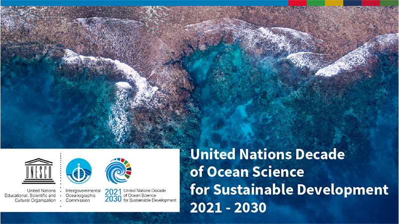 Aerial image of waves breaking over a reef, text on the image says "United Nations Decade of Ocean Science for Sustainable Development"