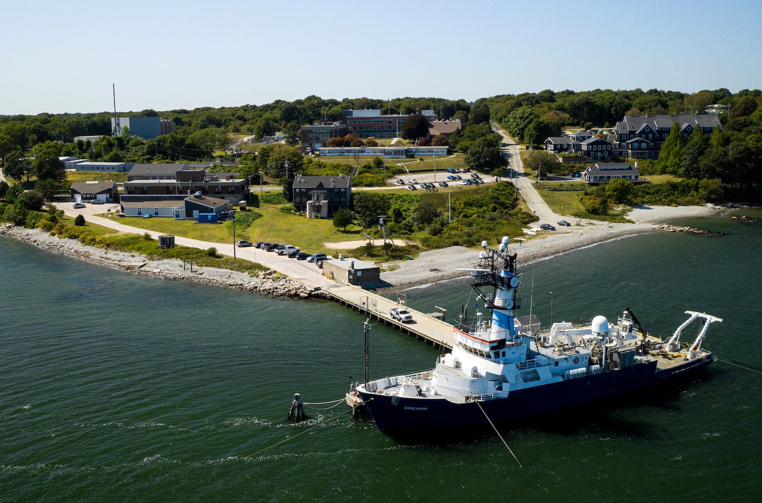 Aerial photo of URI Narragansett Bay Campus with the research Vessel Endeavor in teh foreground.