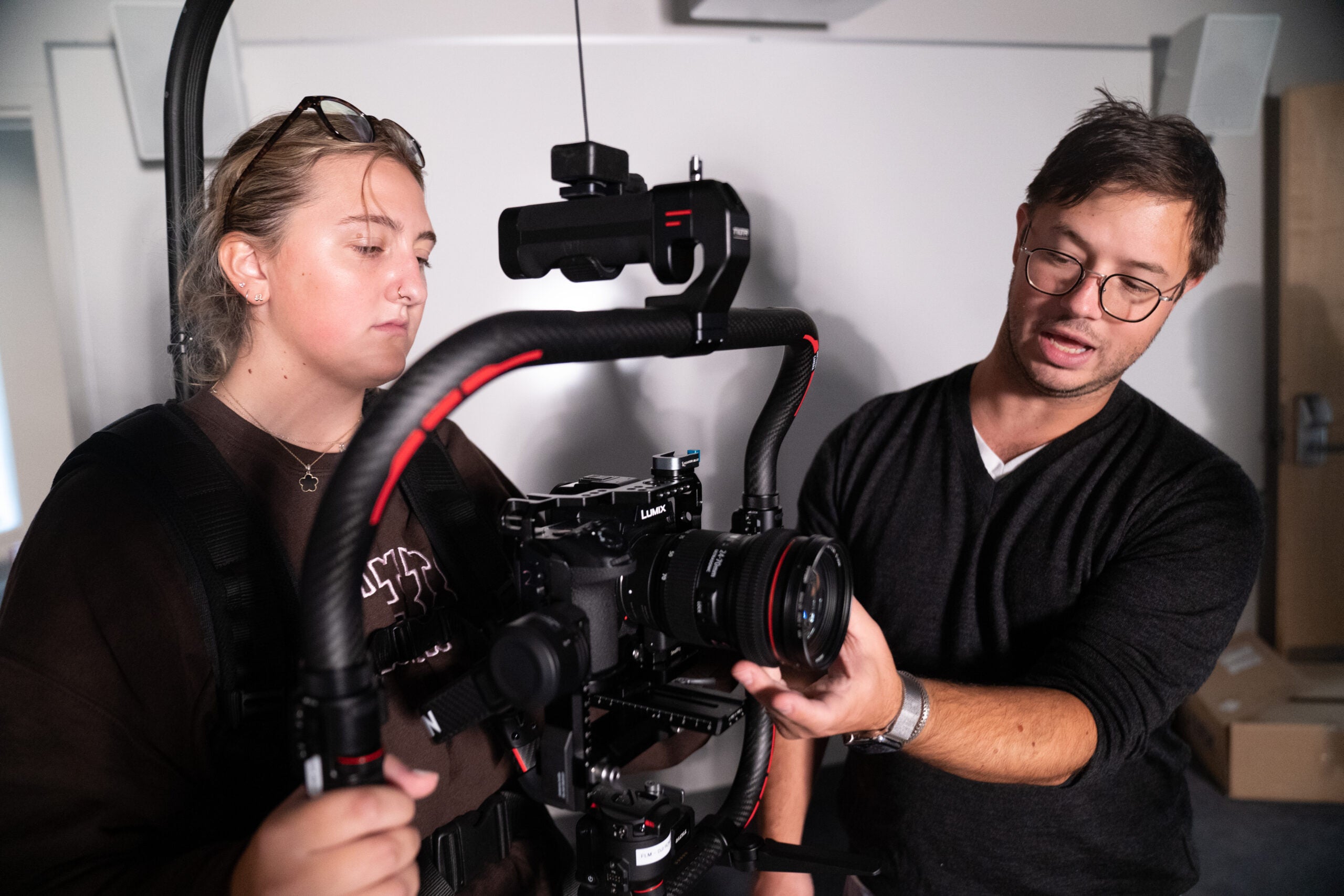 Teaching Professor Nick Corsano working with a student in the film production lab