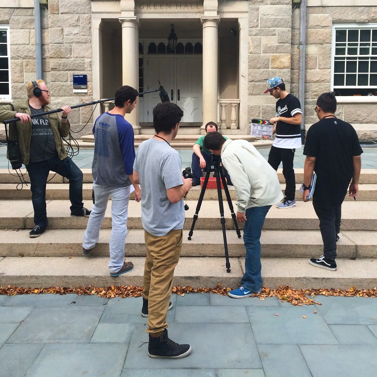 a group of film/media students shooting a scene for a project outside of Green Hall on the Kingston Campus.