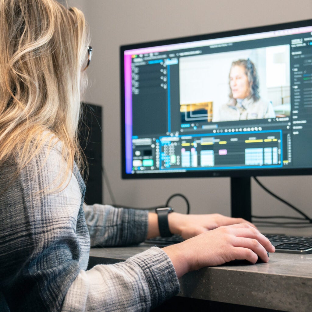 student using editing suite computer