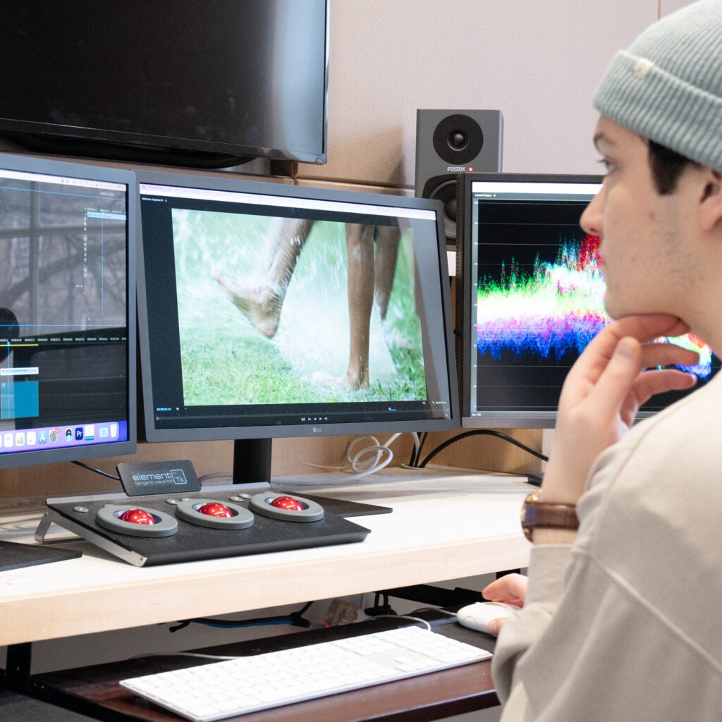 student editing a video