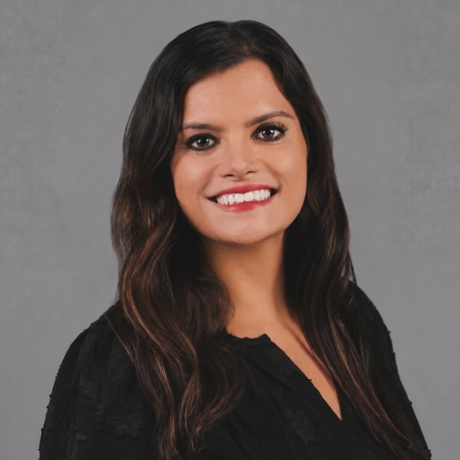 Photo of Sarah DosSantos on a plain background