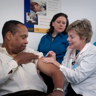 a doctor administering a shot