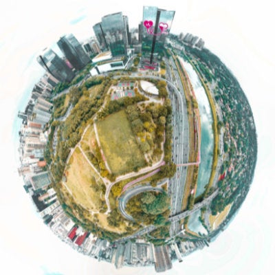 An artwork showing a cityscape, park and water systems imposed over a sphere