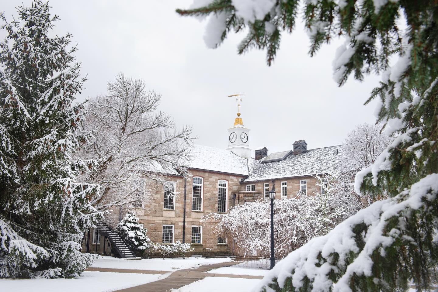Photo of Green Hall in the winter time with snow on the ground.