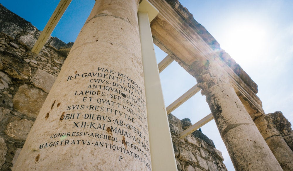 Ancient column with a Latin inscription