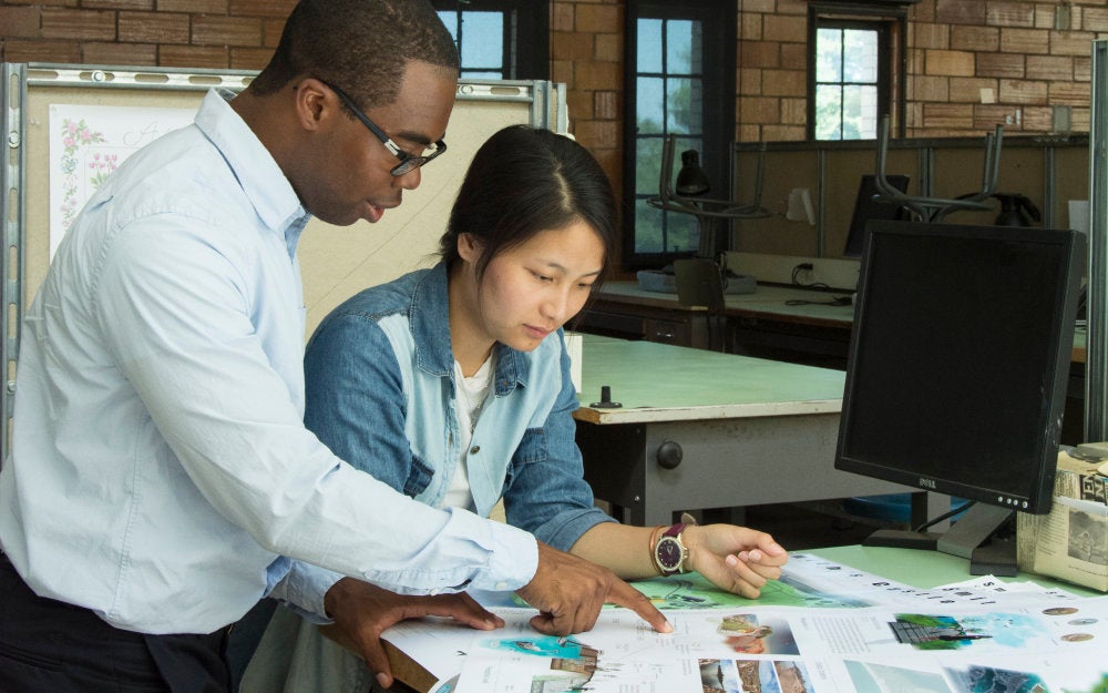a student and professor reviewing a project