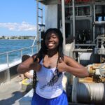 Brianna doing a thumbs up with both hands