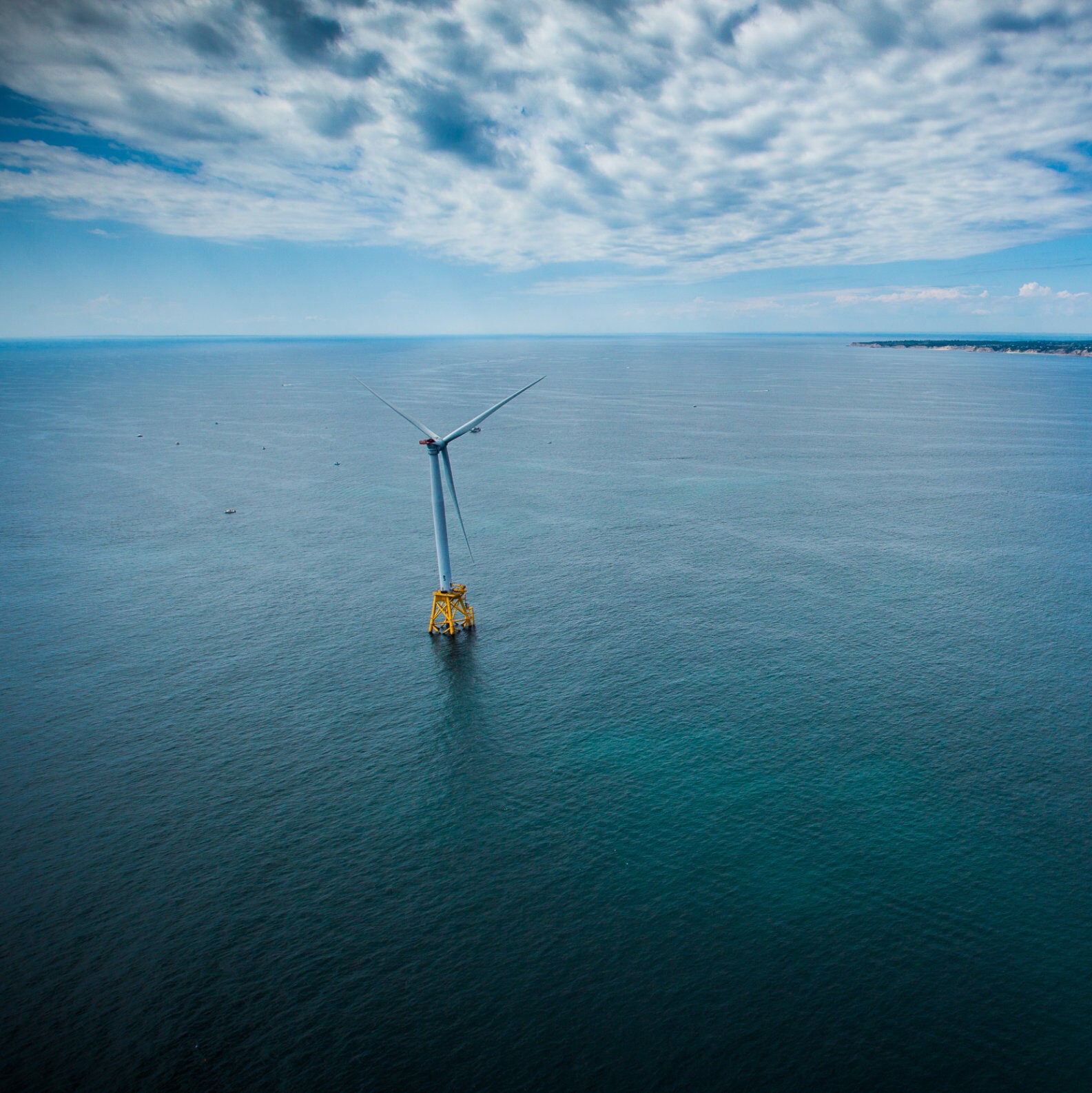 Wind turbine with Block Island, Rhode Island in the distance