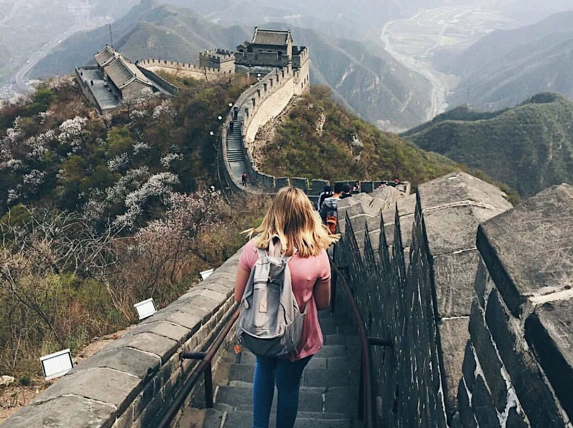 A student walks along the Great Wall of China