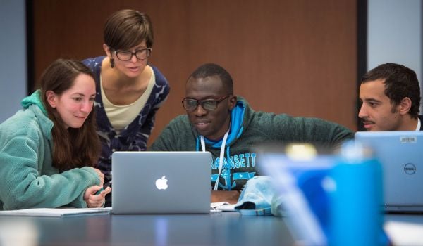 people participating in a data access session using laptops