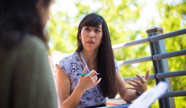 a scientist engages in conversation