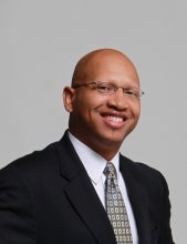 Headshot photo of Sacoby Wilson wearing a suit and tie