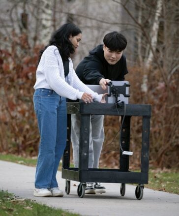 Chan Young Koh and a colleague prepare an expermiment 