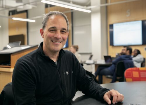 Joe Loberti sits in profile