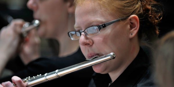 student playing flute