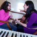 a music therapist works with a client