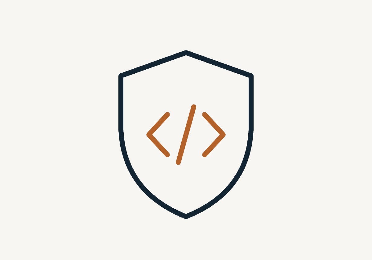 Shield with code brackets