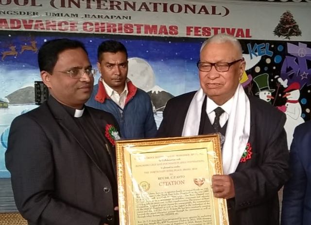Rev. Dr. C. P. Anto receiving a peace award