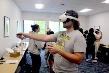 URI nursing student Riley Ferguson works through a virtual medical scenario in the College of Nursing's new virtual reality simulation lab.