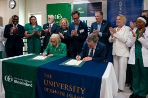 URI President Marc Parlange and CCRI President Rosemary Costigan sign an agreement between the two schools on a fully online Registered Nurse to Bachelor of Science (RN-to-BS) program during a signing ceremony on Oct. 1.
