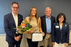 URI nursing student Alexis Melanson is pictured with Dean Danny Willis, Flynn Foundation founder and President Fred Flynn, and HopeHealth President and CEO Diana Franchitto at Melanson's graduation from the Susan D. Flynn Palliative Care Undergraduate Fellowship at HopeHealth.