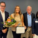 URI nusing student Alexis Melanson is pictured with Dean Danny Willis, Flyn Foundation founder and President Fred Flynn, and HopeHealth President and CEO Diana Franchitto at Melanson's graduation from the Susan D. Flynn Palliative Care Undergraduate Fellowship.