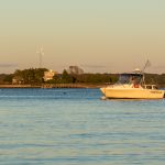 A fishing boat on Narragansett Bay at sunset