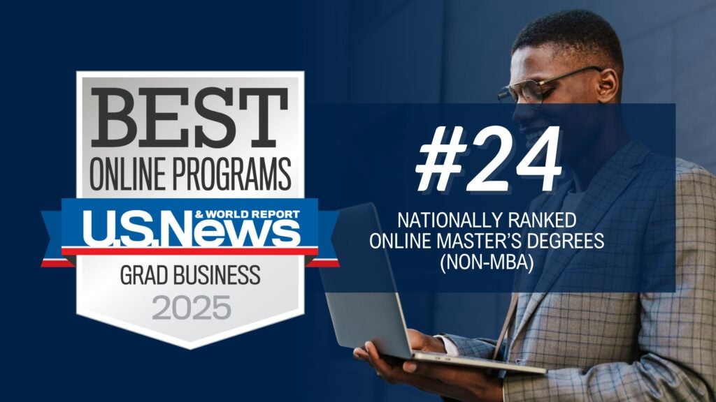 The image is divided into two sections. On the left side, there is a large rectangular graphic on a dark blue background. This graphic features a badge that reads "BEST ONLINE PROGRAMS" prominently in gray and black. Below it, a blue and red ribbon with "U.S. News & World Report" is visible, with "GRAD BUSINESS 2025" written underneath in white. On the right side of the image, a man is seen wearing glasses and a plaid suit jacket. He is holding and looking at an open laptop. Overlaid text on this section reads "#24 NATIONALLY RANKED ONLINE MASTER’S DEGREES (NON-MBA)" in white on a dark blue background.