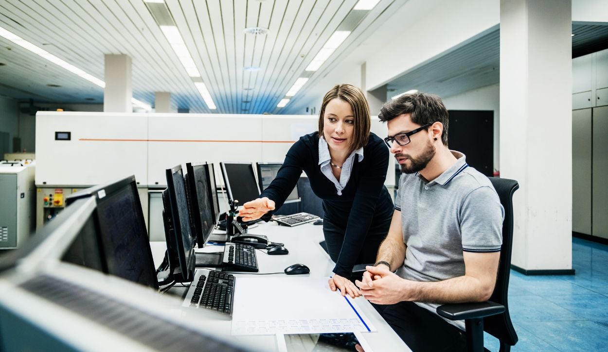 A female manager works with a male operations engineer