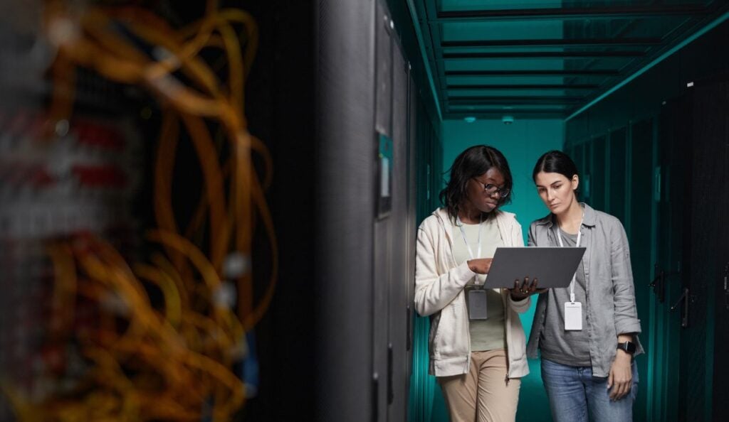 Women managing servers in data center