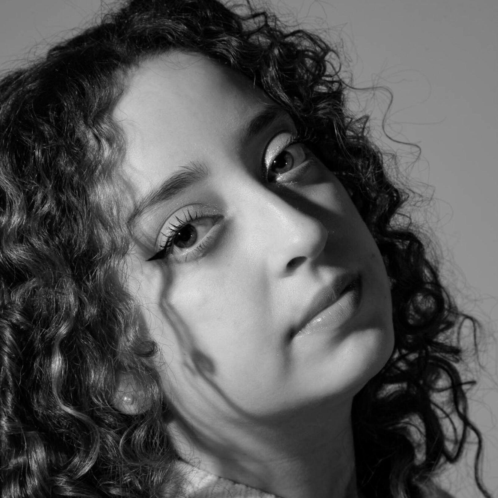 Black and white headshot of Jailene Guzmán