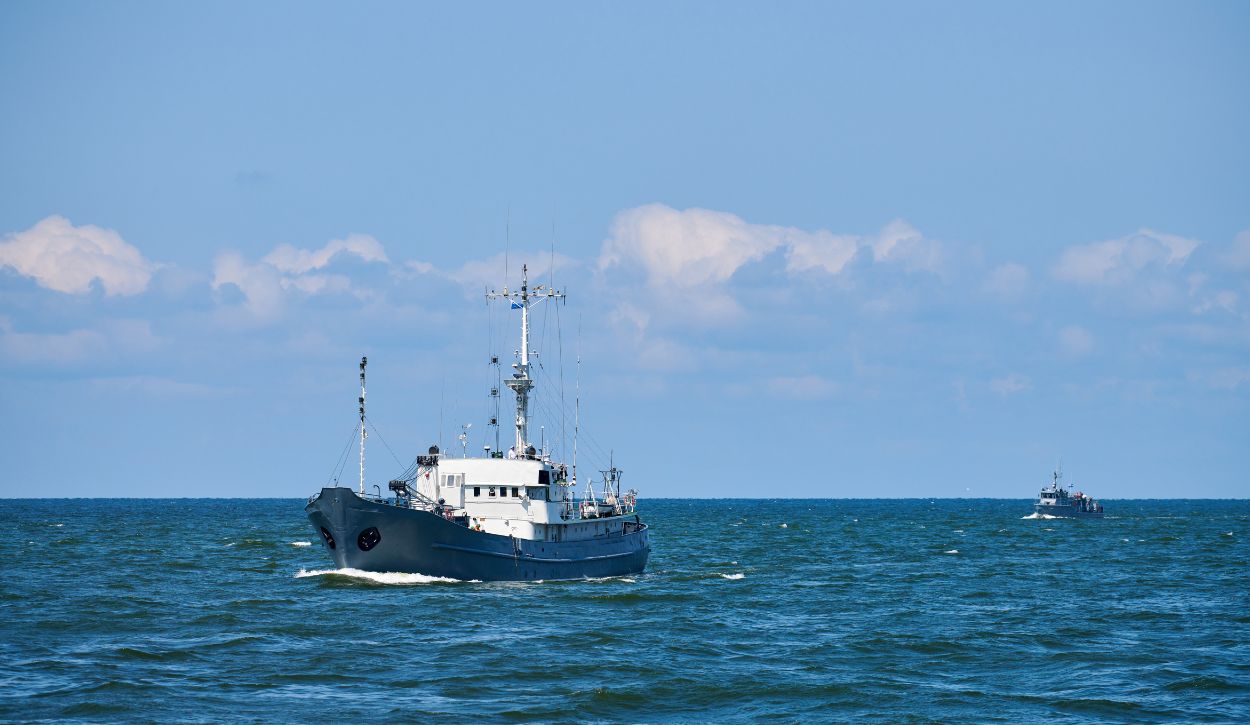 Research vessel patrol boat sailing in bright blue Baltic Sea