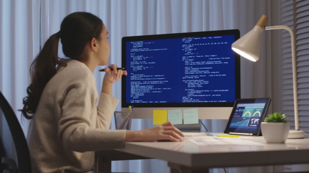 A woman works on a computer