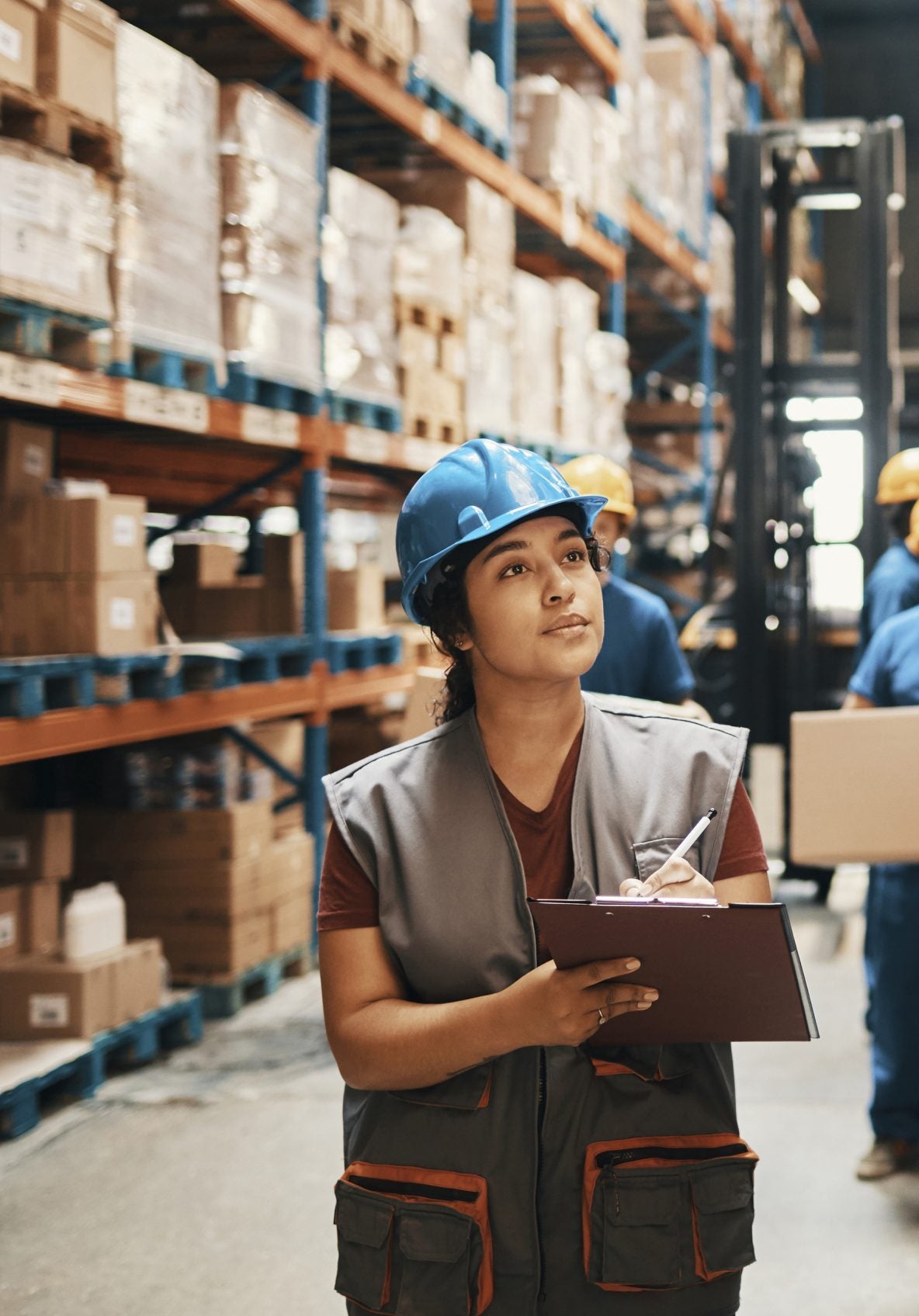 Warehouse Worker taking notes