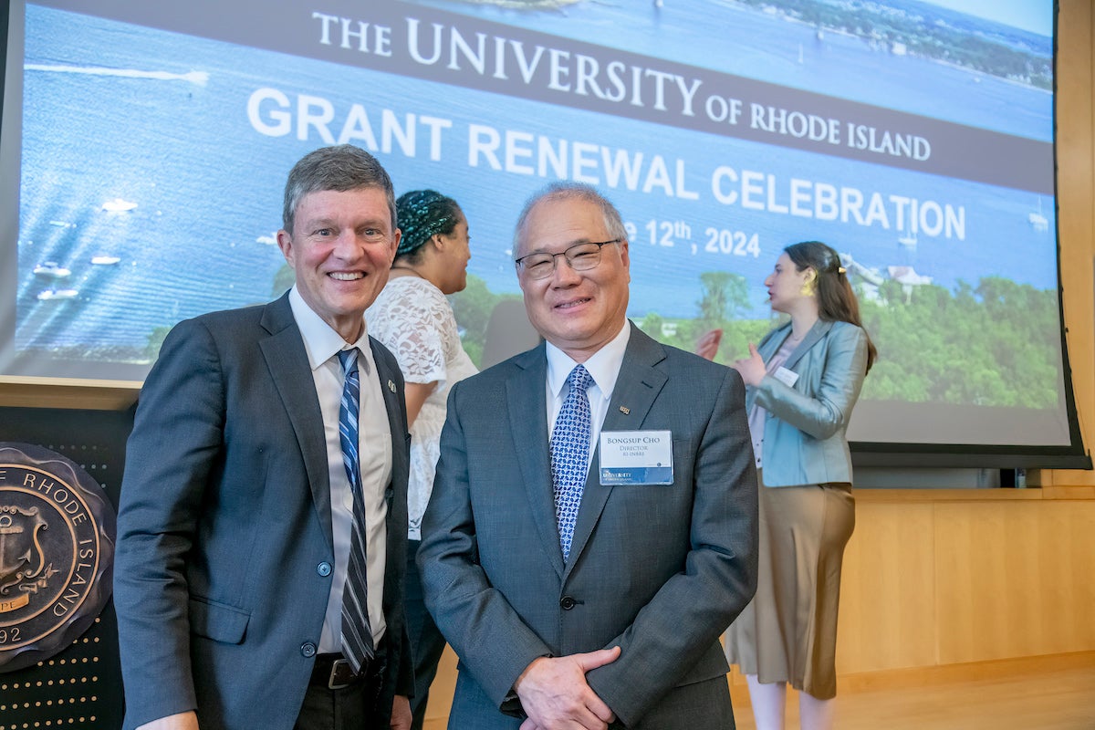 URI President Marc Parlange and pharmacy Professor Bongsup Cho, director of RI-INBRE, announced an additional $21 million in federal funding for the biomedical research network, increasing the organization's funding to more than $100 million.