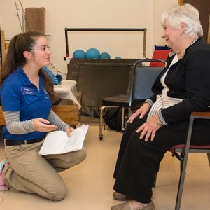 Antoinette Gagliard, a physical therapy major from Walpole, Mass., works with Pauline Tudino of Narragansett during the Senior Health and Wellness Program held at URI in October.