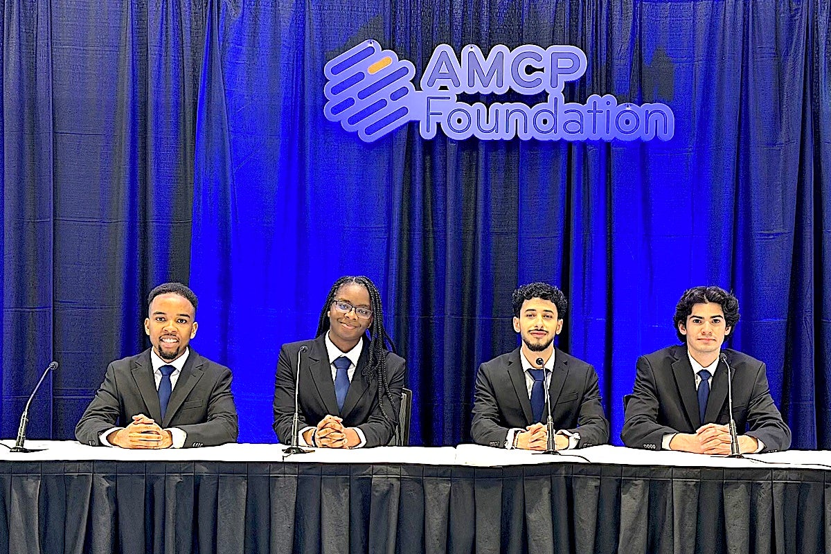 URI College of Pharmacy students Willy Njeru (left), Vanessa Oseghale, Matthew Pari, and Ramez Rizk finished ahead of 67 other colleges of pharmacy from around the country to win the 2026 Academy of Managed Care Pharmacy Foundation's National Student Pharmacist Pharmacy & Therapeutics Competition.