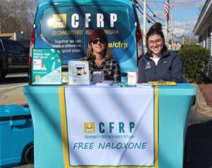 URI College of Pharmacy Clinical Associate Professor Anita Jacobson (left) and former Pharm.D. student Emily Lancor '24 distribute Narcan at a community site in Hope Valley, Rhode Island.