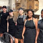 URI nutrition students work in the kitchen at Camp JORI in South Kingstown, site of Camp Surefire, a week-long summer camp for children living with Type 1 diabetes.