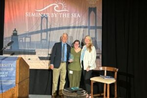 URI College of Pharmacy Dean Emeritus Paul Larrat receives the Norman A. Campbell Award for Ethics and Excellence in Health Care from Dean Kerry LaPlante (right) and Linda Campbell, daughter of Norman Campbell.