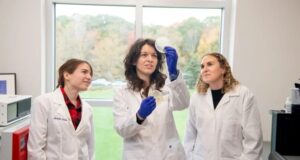 Assistant Professor Claudia Fallini (center) is pictured with graduate students Michelle Gregoire and Emily Potts.